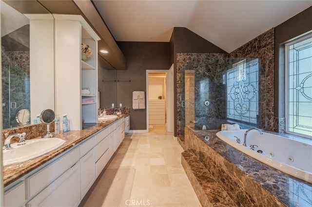 435 S Estate Dr, Orange, CA 92869 - full bathroom with healthy amount of natural light, a tub with jets, double vanity, vaulted ceiling, and a tile shower