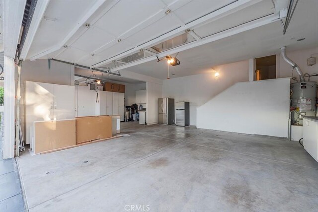 435 S Estate Dr, Orange, CA 92869 - garage with water heater, freestanding refrigerator, and a garage door opener