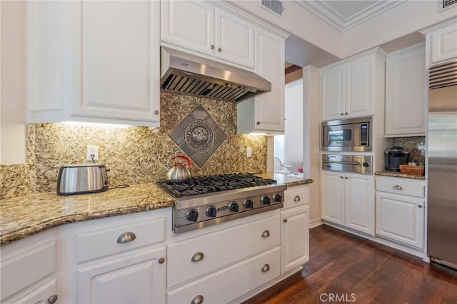 435 S Estate Dr, Orange, CA 92869 - kitchen with under cabinet range hood, built in appliances, a warming drawer, white cabinets, and dark wood finished floors