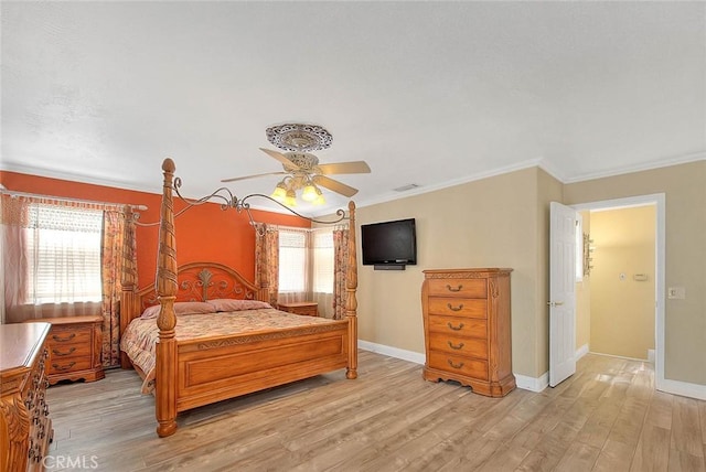 bedroom with ornamental molding, baseboards, light wood-type flooring, and ceiling fan