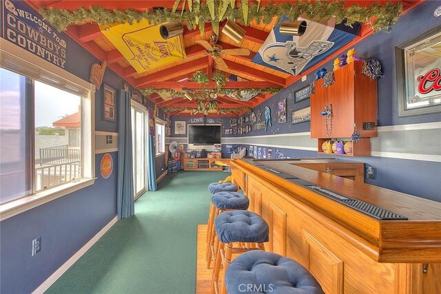 game room featuring a dry bar and carpet flooring