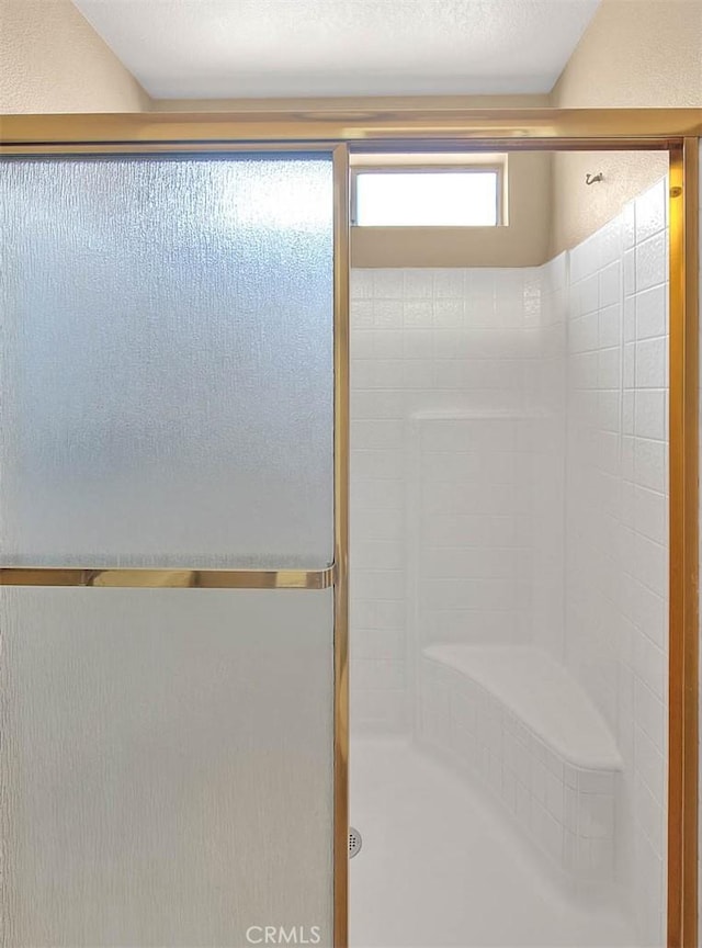 full bathroom featuring a stall shower