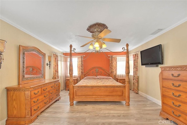 bedroom featuring crown molding, light wood-style flooring, baseboards, and a ceiling fan