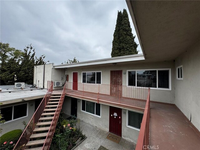 10622 Tibbs Cir, Garden Grove, CA 92840 - back of house with stairs and stucco siding
