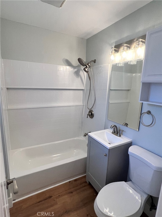 5046 Pacific Ave, Long Beach, CA 90805 - bathroom featuring wood finished floors, toilet, tub / shower combination, and vanity