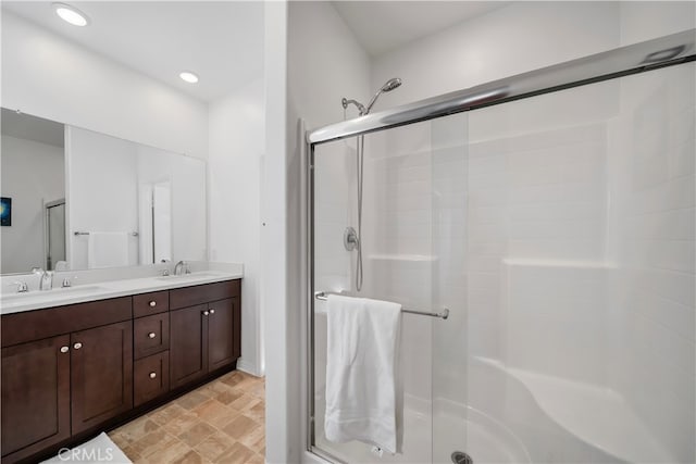 8713 Roving Pl, Chino, CA 91708 - bathroom featuring a shower stall, double vanity, and recessed lighting