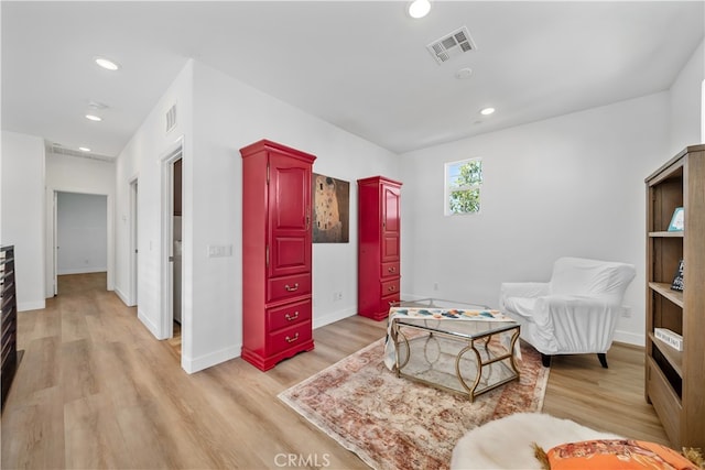 8713 Roving Pl, Chino, CA 91708 - sitting room with light wood finished floors, recessed lighting, and baseboards
