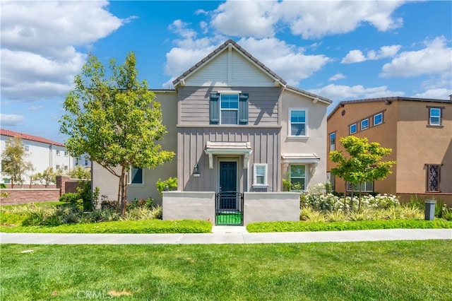 8713 Roving Pl, Chino, CA 91708 - view of front of home with board and batten siding and a gate
