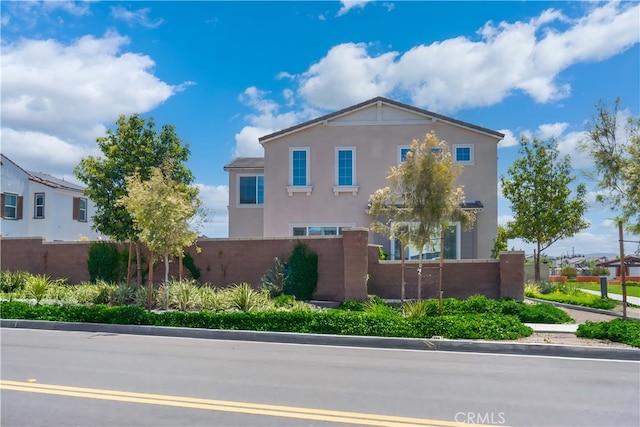8713 Roving Pl, Chino, CA 91708 - view of side of home featuring stucco siding