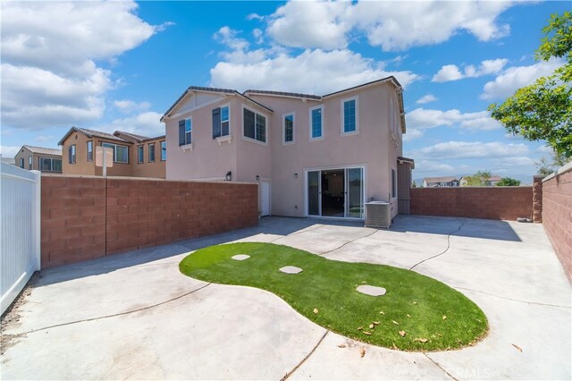8713 Roving Pl, Chino, CA 91708 - back of property featuring a patio area, a fenced backyard, and stucco siding
