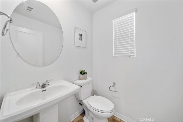 8713 Roving Pl, Chino, CA 91708 - bathroom with a sink, toilet, and baseboards