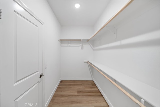 8713 Roving Pl, Chino, CA 91708 - spacious closet featuring light wood-style flooring
