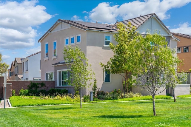 8713 Roving Pl, Chino, CA 91708 - rear view of house with stucco siding and a tiled roof