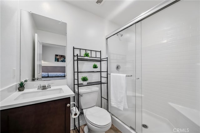 8713 Roving Pl, Chino, CA 91708 - bathroom featuring a stall shower, toilet, and vanity