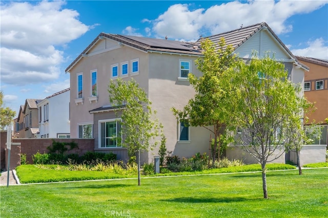 8713 Roving Pl, Chino, CA 91708 - view of side of property featuring stucco siding and a tiled roof