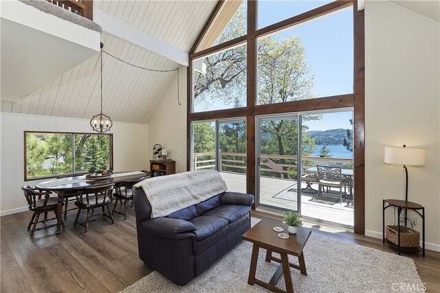 27559 N Bay, Lake Arrowhead, CA 92352 - living room featuring a chandelier, high vaulted ceiling, dark wood-style flooring, beamed ceiling, and baseboards
