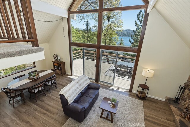 27559 N Bay, Lake Arrowhead, CA 92352 - living room featuring wood finished floors, baseboards, high vaulted ceiling, a water view, and wooden ceiling with exposed beams