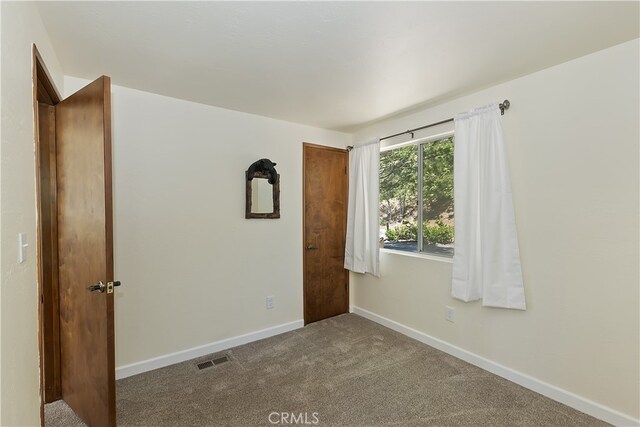 27559 N Bay, Lake Arrowhead, CA 92352 - unfurnished room featuring baseboards and carpet flooring