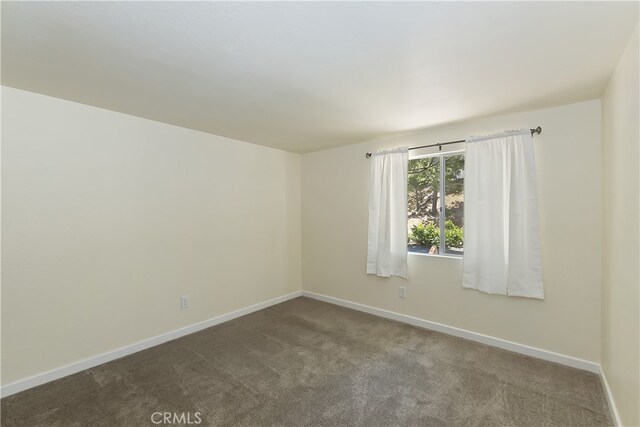 27559 N Bay, Lake Arrowhead, CA 92352 - spare room featuring baseboards and dark colored carpet