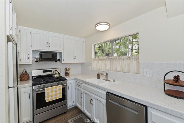 27559 N Bay, Lake Arrowhead, CA 92352 - kitchen with appliances with stainless steel finishes, a sink, light countertops, and white cabinets