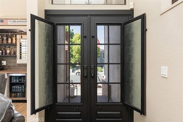25311 Darlington, Mission Viejo, CA 92692 - doorway featuring french doors, a textured wall, wine cooler, and wood finished floors
