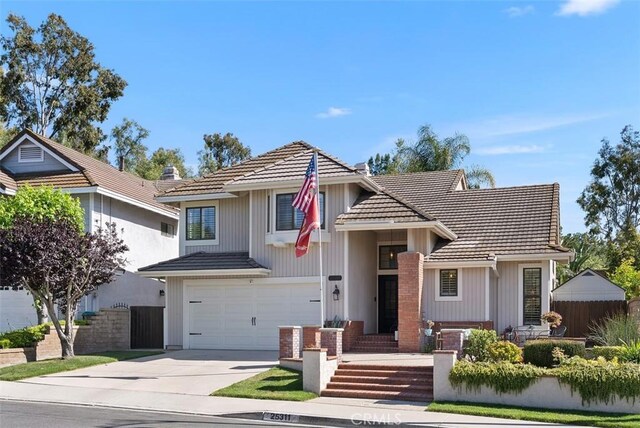 25311 Darlington, Mission Viejo, CA 92692 - view of front of property with a tiled roof, driveway, and an attached garage