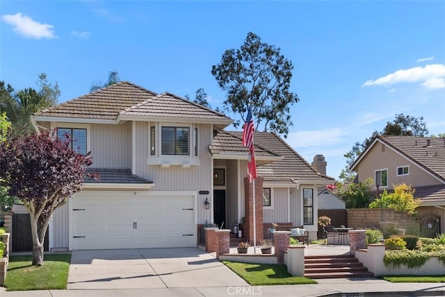 25311 Darlington, Mission Viejo, CA 92692 - view of front of home with a tile roof, an attached garage, driveway, and a chimney