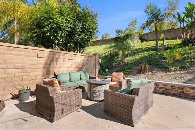 25311 Darlington, Mission Viejo, CA 92692 - fenced backyard with an outdoor living space with a fire pit and a patio