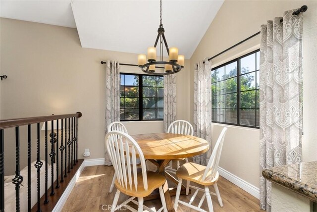 25311 Darlington, Mission Viejo, CA 92692 - dining area with a chandelier, light wood-type flooring, baseboards, and vaulted ceiling
