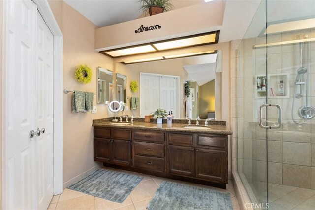 25311 Darlington, Mission Viejo, CA 92692 - full bath with tile patterned floors, a shower stall, double vanity, baseboards, and a closet