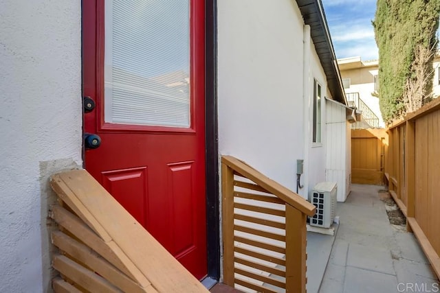 5028 Monroe Ave, San Diego, CA 92115 - doorway to property with stucco siding and a cooling unit