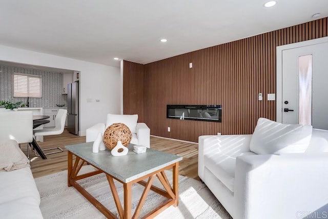 5028 Monroe Ave, San Diego, CA 92115 - living room featuring light wood-style floors, recessed lighting, and an accent wall