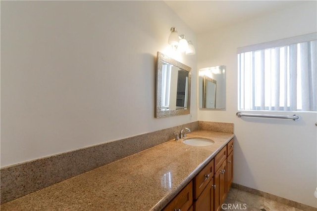801 E 1st St Unit 17, Long Beach, CA 90802 - bathroom with vanity, tile patterned floors, and baseboards
