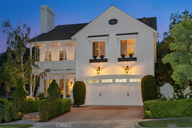 3 Blue Spruce Dr, Ladera Ranch, CA 92694 - view of front of home with a chimney, concrete driveway, an attached garage, and a balcony