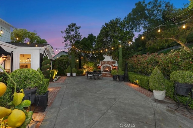 3 Blue Spruce Dr, Ladera Ranch, CA 92694 - view of patio with a warm lit fireplace