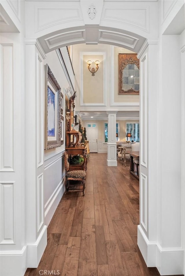 3 Blue Spruce Dr, Ladera Ranch, CA 92694 - corridor with ornate columns, a decorative wall, and dark wood finished floors
