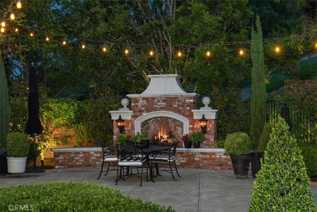 3 Blue Spruce Dr, Ladera Ranch, CA 92694 - view of patio / terrace featuring an outdoor brick fireplace and outdoor dining space