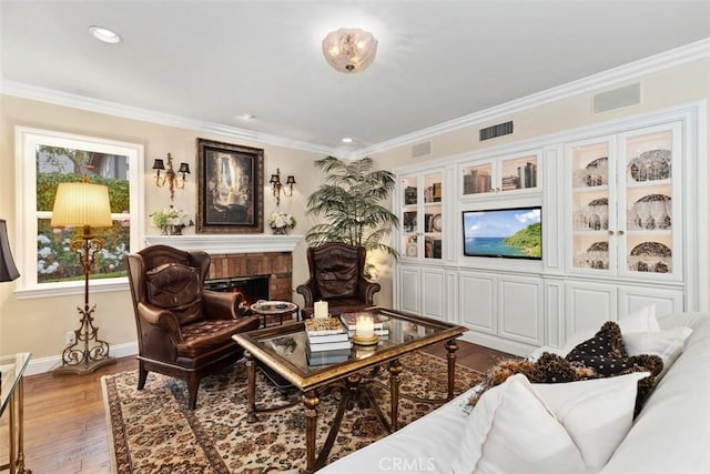3 Blue Spruce Dr, Ladera Ranch, CA 92694 - living area featuring crown molding, a brick fireplace, wood finished floors, and recessed lighting