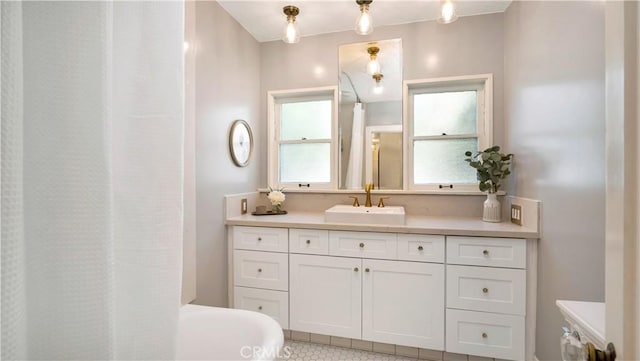 2336 N Riverside Dr, Santa Ana, CA 92706 - full bathroom with vanity, tile patterned flooring, and a tub
