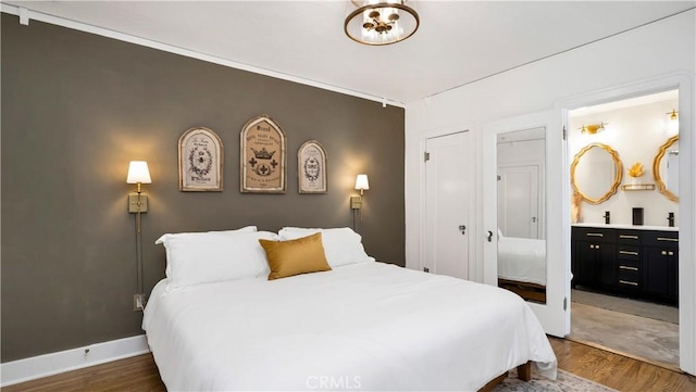 2336 N Riverside Dr, Santa Ana, CA 92706 - bedroom with dark wood-type flooring and a closet