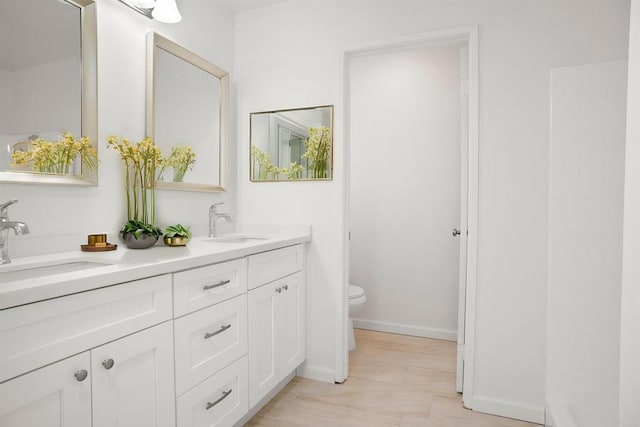 4888 Northerly St, Oceanside, CA 92056 - bathroom with toilet, double vanity, and baseboards