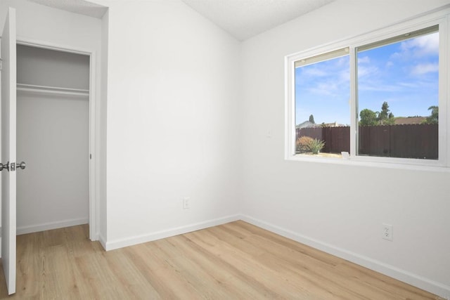 4888 Northerly St, Oceanside, CA 92056 - unfurnished bedroom with light wood-style floors, baseboards, and a closet