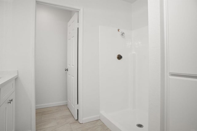 4888 Northerly St, Oceanside, CA 92056 - bathroom with a stall shower, vanity, and baseboards