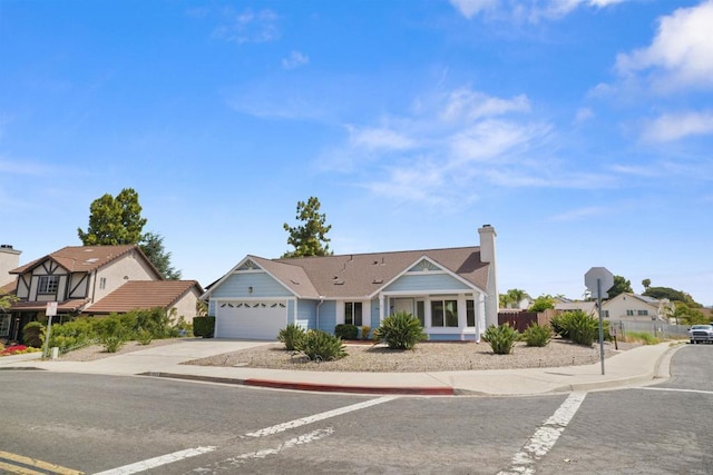 4888 Northerly St, Oceanside, CA 92056 - view of front of home with an attached garage, driveway, and a chimney