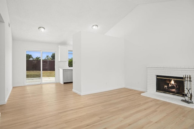 4888 Northerly St, Oceanside, CA 92056 - unfurnished living room with light wood finished floors, a fireplace, and baseboards