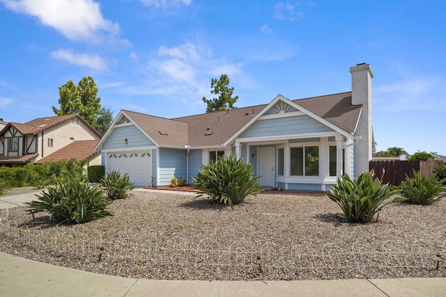 4888 Northerly St, Oceanside, CA 92056 - view of front of property with an attached garage, a chimney, and a shingled roof