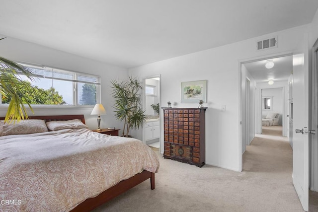 9502 El Portal Ct, Ventura, CA 93004 - bedroom featuring light colored carpet and ensuite bathroom