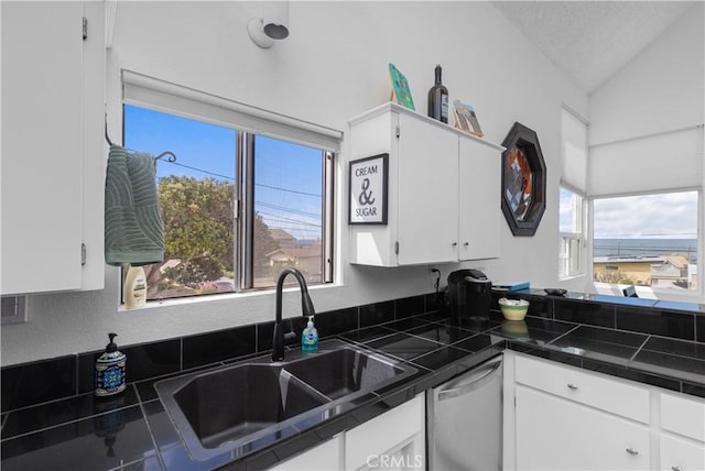 1983 Cirlce Dr, Cayucos, CA 93430 - kitchen with dishwasher, a sink, white cabinetry, and lofted ceiling
