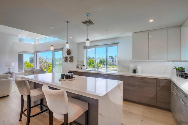 747 S Cedros Ave, Solana Beach, CA 92075 - kitchen featuring modern cabinets, plenty of natural light, a kitchen breakfast bar, a sink, and recessed lighting