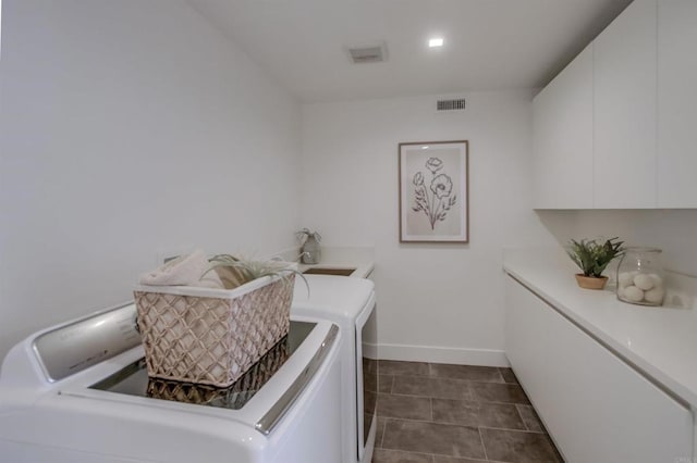 747 S Cedros Ave, Solana Beach, CA 92075 - laundry room featuring washer and clothes dryer, cabinet space, baseboards, and dark tile patterned flooring